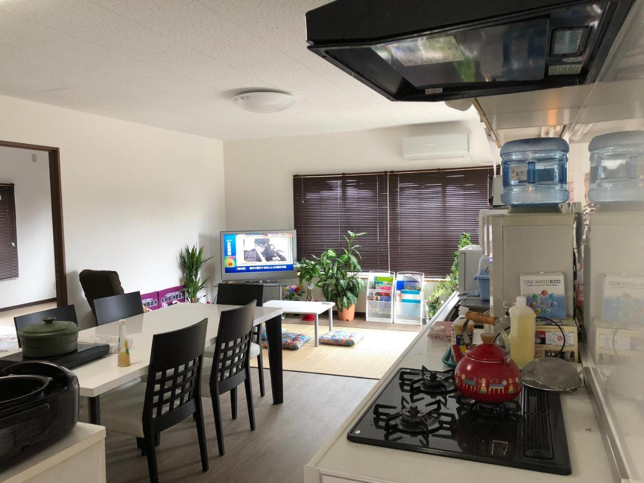 Yoko House Hotel Uruma Bagian luar foto